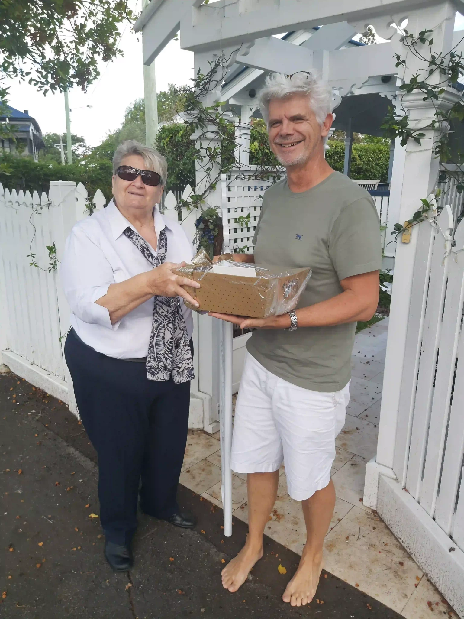 Elderly Couple Gift Moment