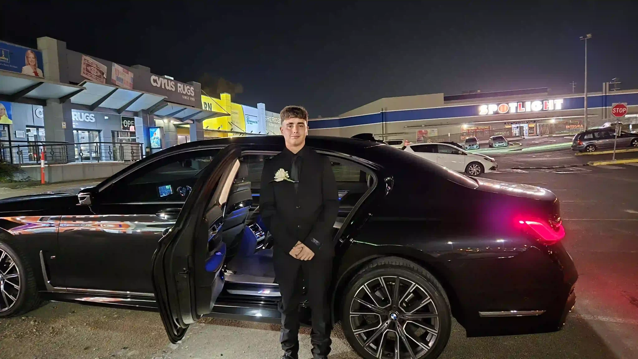 Man standing in front of luxury hire car