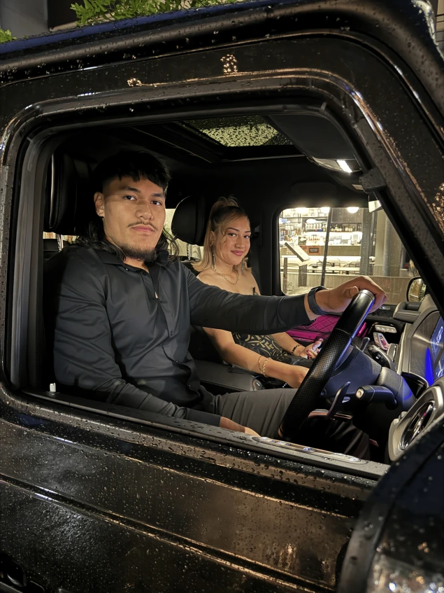 Couple in chauffeured car
